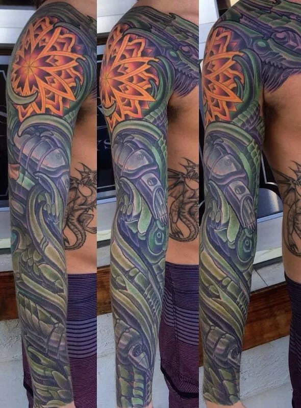 Biomechanical bodysuit tattoo, full arm sleeve with an ornamental mandala at the shoulder, shown from three angles by Terry Ribera at Remington Tattoo in San Diego.
