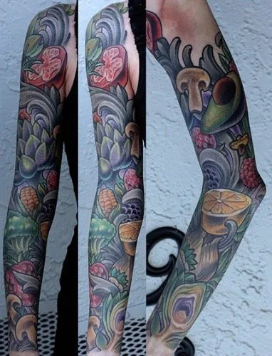 Full color illustrative arm sleeve tattoo of fruit, vegetables and mushrooms with ornamental scrollwork, shown from three angles by Terry Ribera at Remington Tattoo in San Diego.
