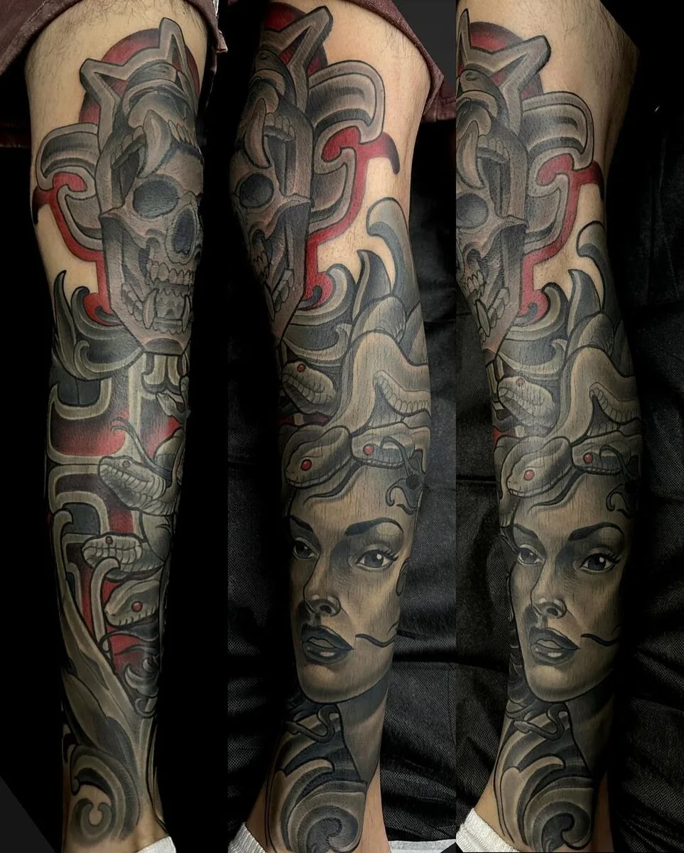 Illustrative black and grey Medusa skull leg sleeve tattoo by Terry Ribera, San Diego