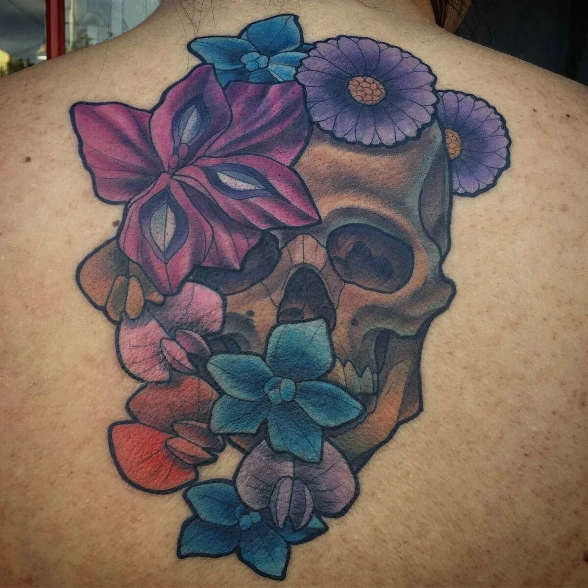 Neo Traditional skull wildflowers back tattoo by Terry Ribera, San Diego