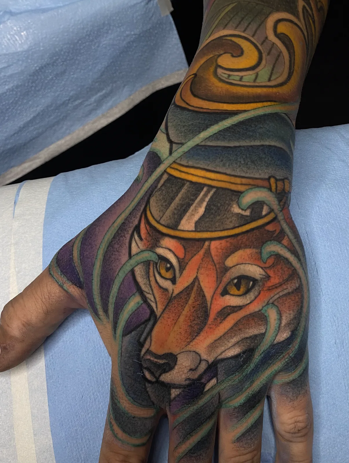 Color neo traditional fox hand tattoo by Terry Ribera, San Diego