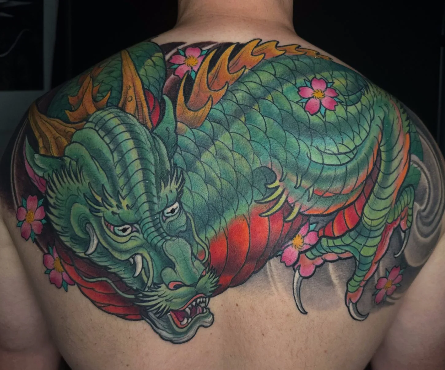 Neo Japanese green dragon upper back cherry blossom tattoo by Terry Ribera, San Diego