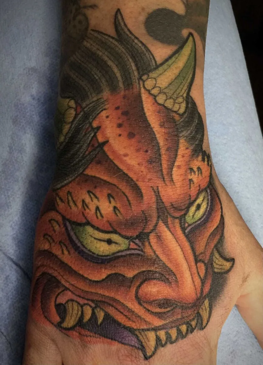 Neo Japanese hannya mask hand tattoo by Terry Ribera, San Diego