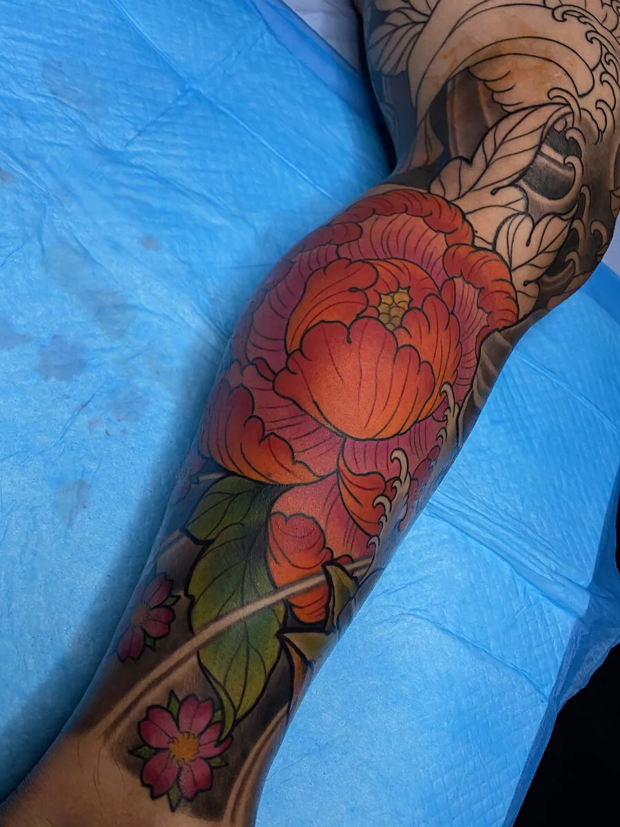 Neo Japanese red peony calf cherry blossom tattoo by Terry Ribera, San Diego