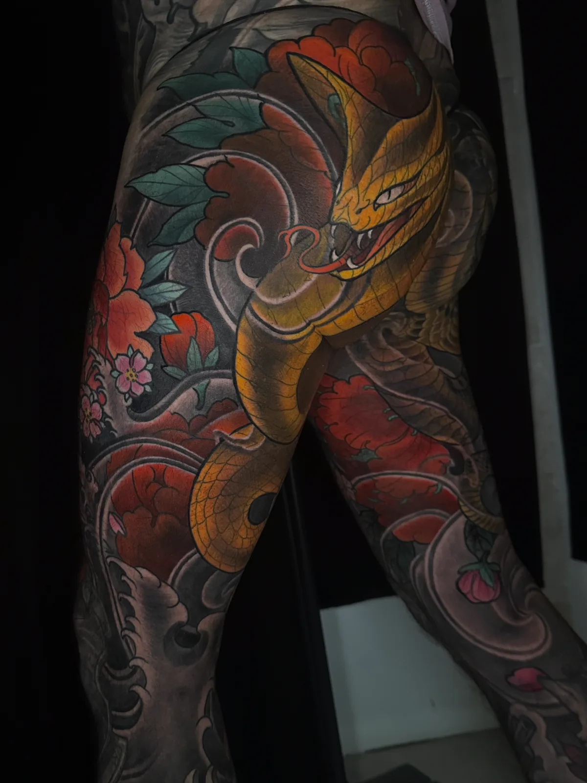 Color Neo Japanese cobra and peony leg tattoo by Terry Ribera, San Diego