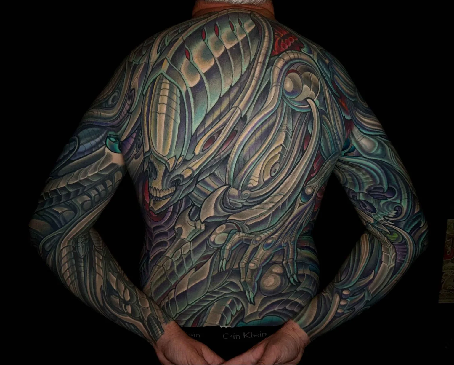 Bio-organic alien skull large back piece bodysuit tattoo by Terry Ribera, San Diego