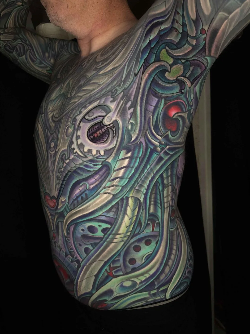 Bio-organic color side torso gear eye bodysuit tattoo by Terry Ribera, San Diego