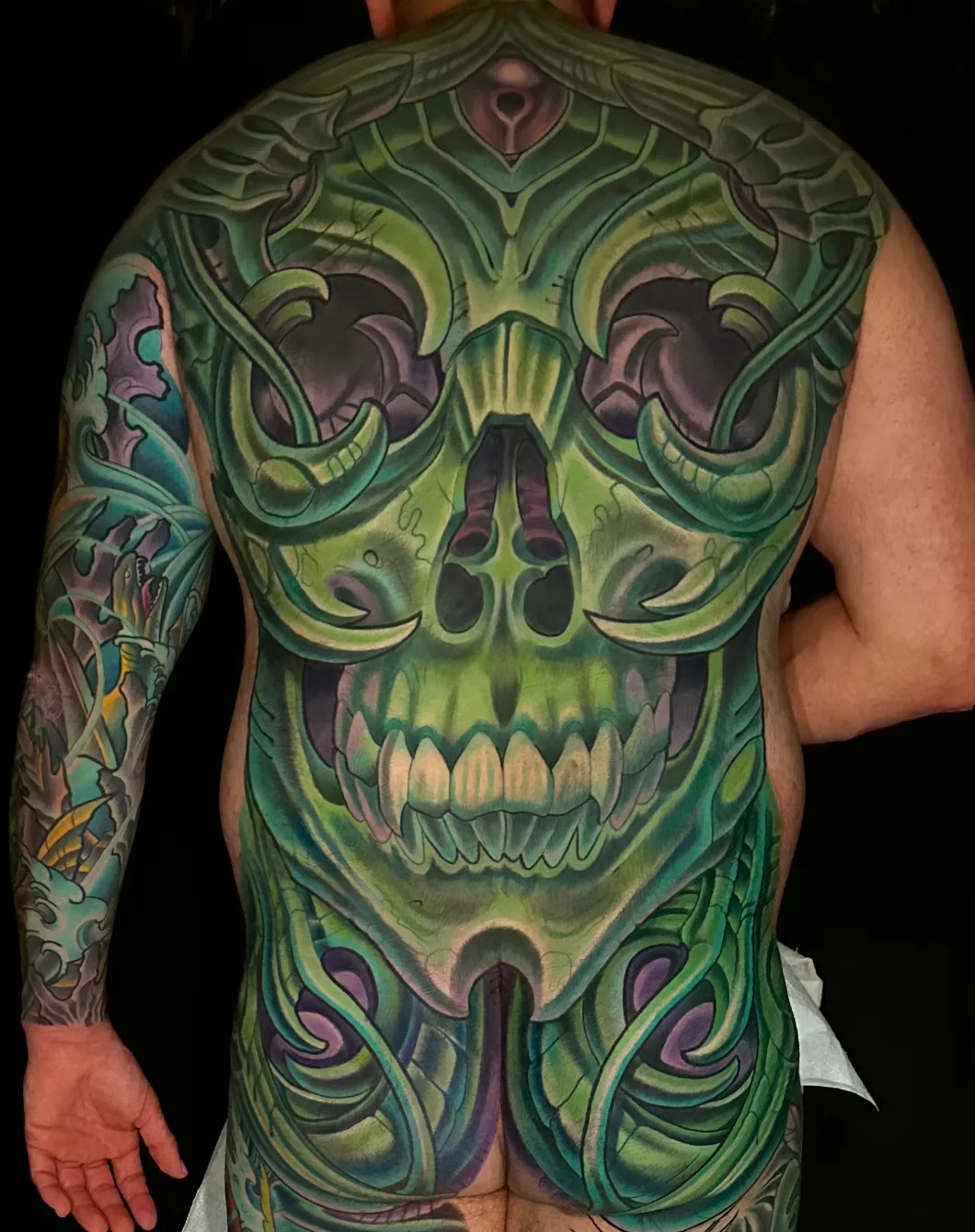 Bio-organic green skull full back tattoo by Terry Ribera, San Diego