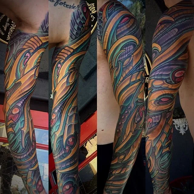 Bio-organic orange purple colorful full sleeve tattoo by Terry Ribera, San Diego