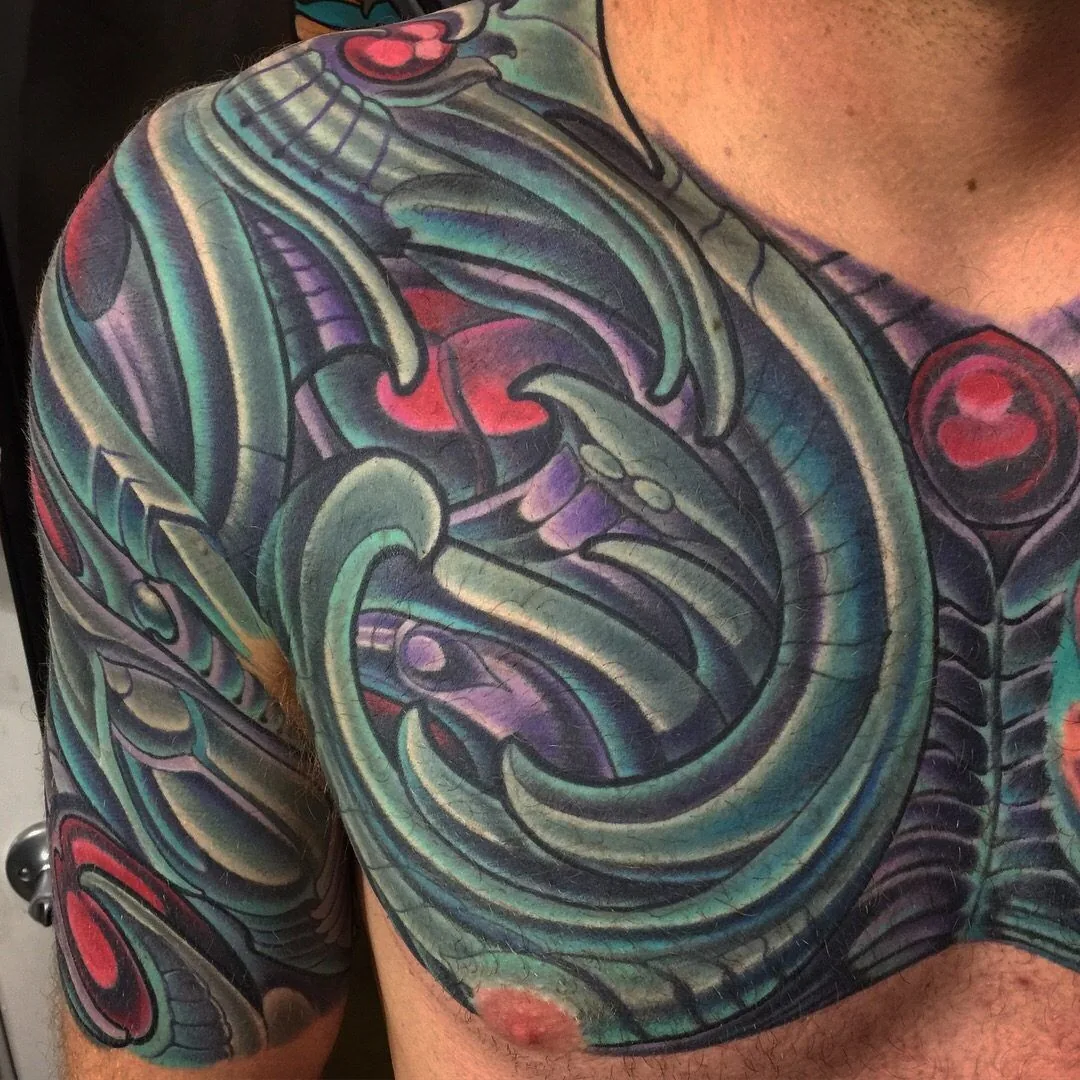Biomechanical bio-organic chest shoulder tattoo by Terry Ribera, San Diego