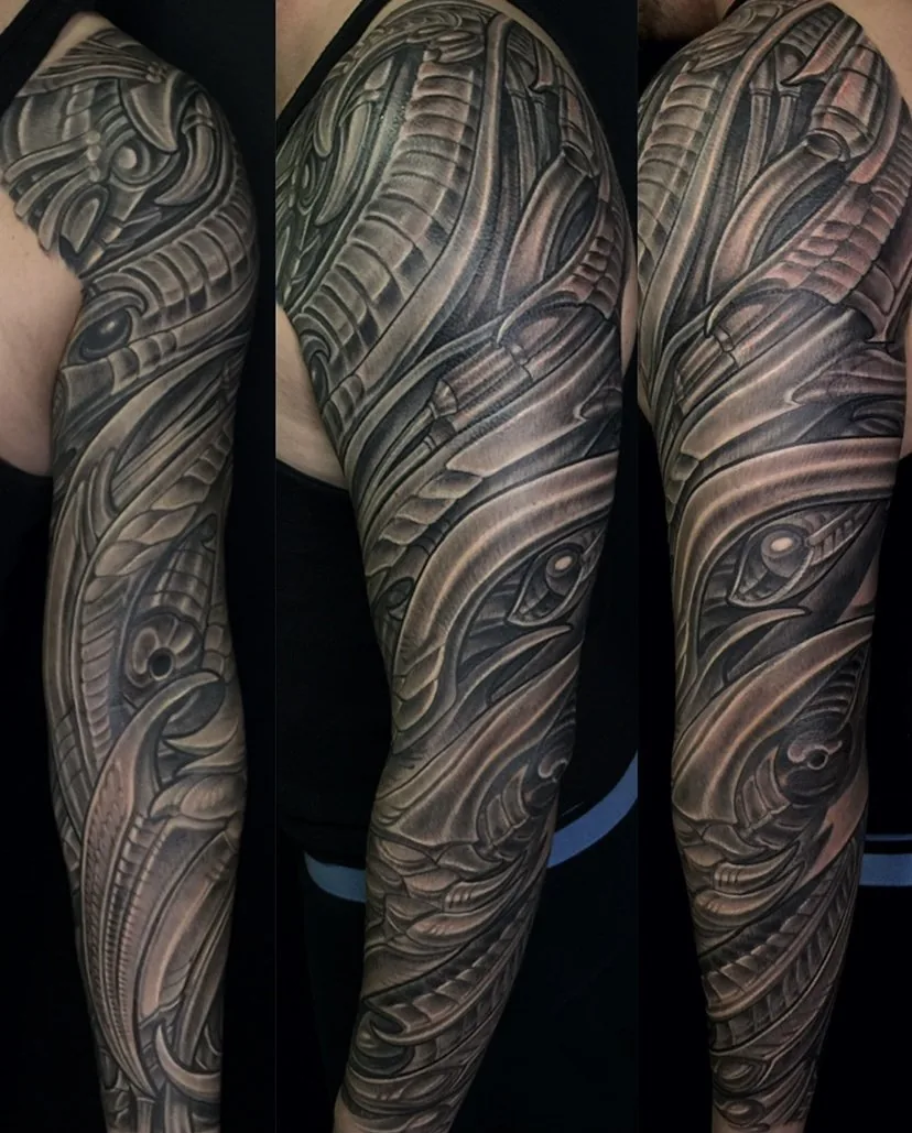 Biomechanical black grey alien eye full sleeve tattoo by Terry Ribera, San Diego