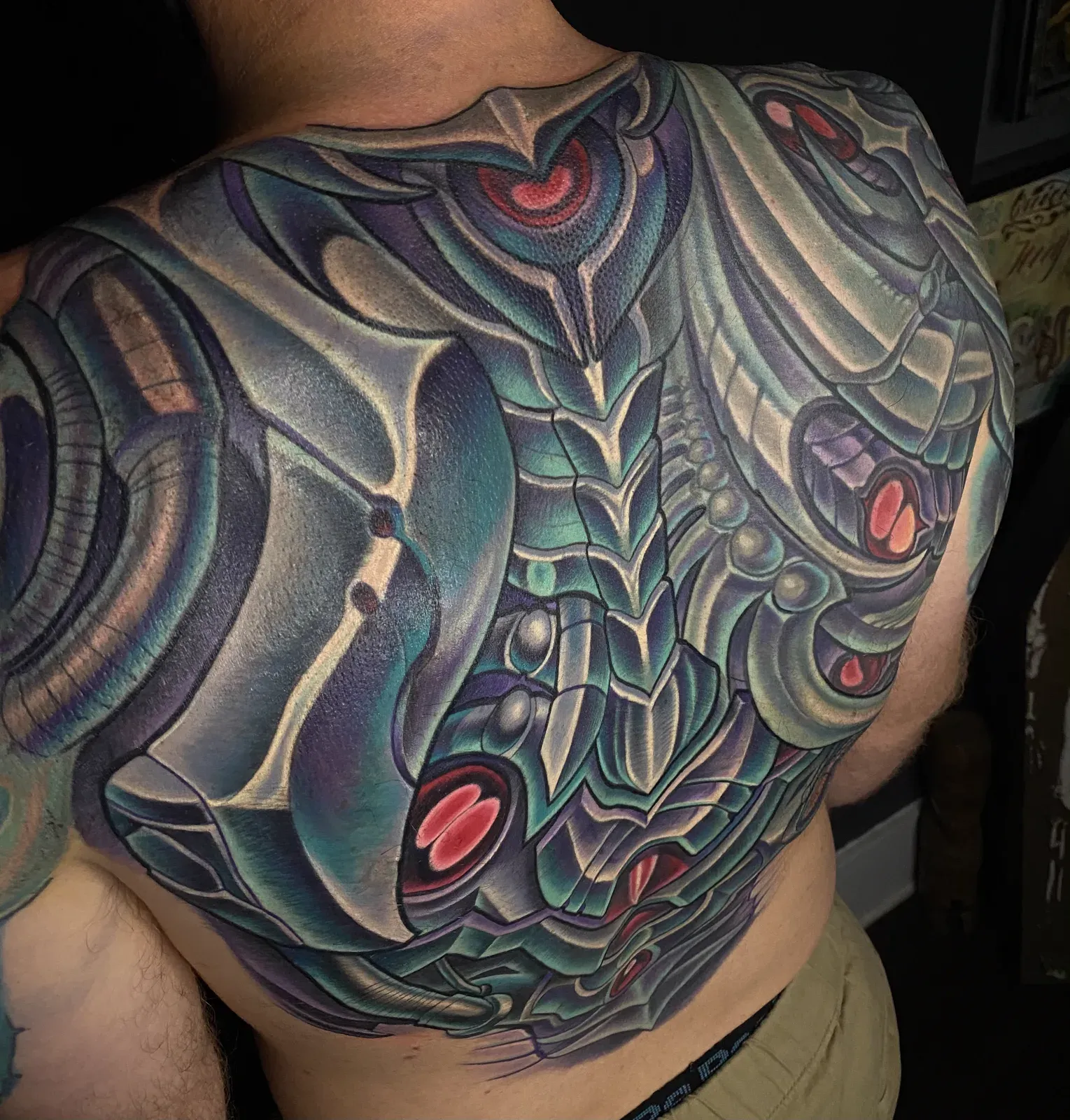 Black and grey biomechanical and bio-organic chest and torso tattoo by Terry Ribera, San Diego