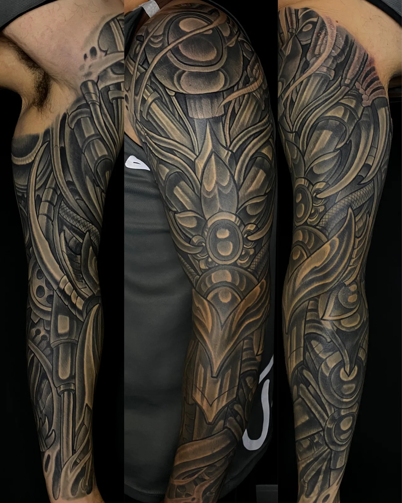 Black and grey biomechanical and bio-organic leg sleeve tattoo by Terry Ribera, San Diego