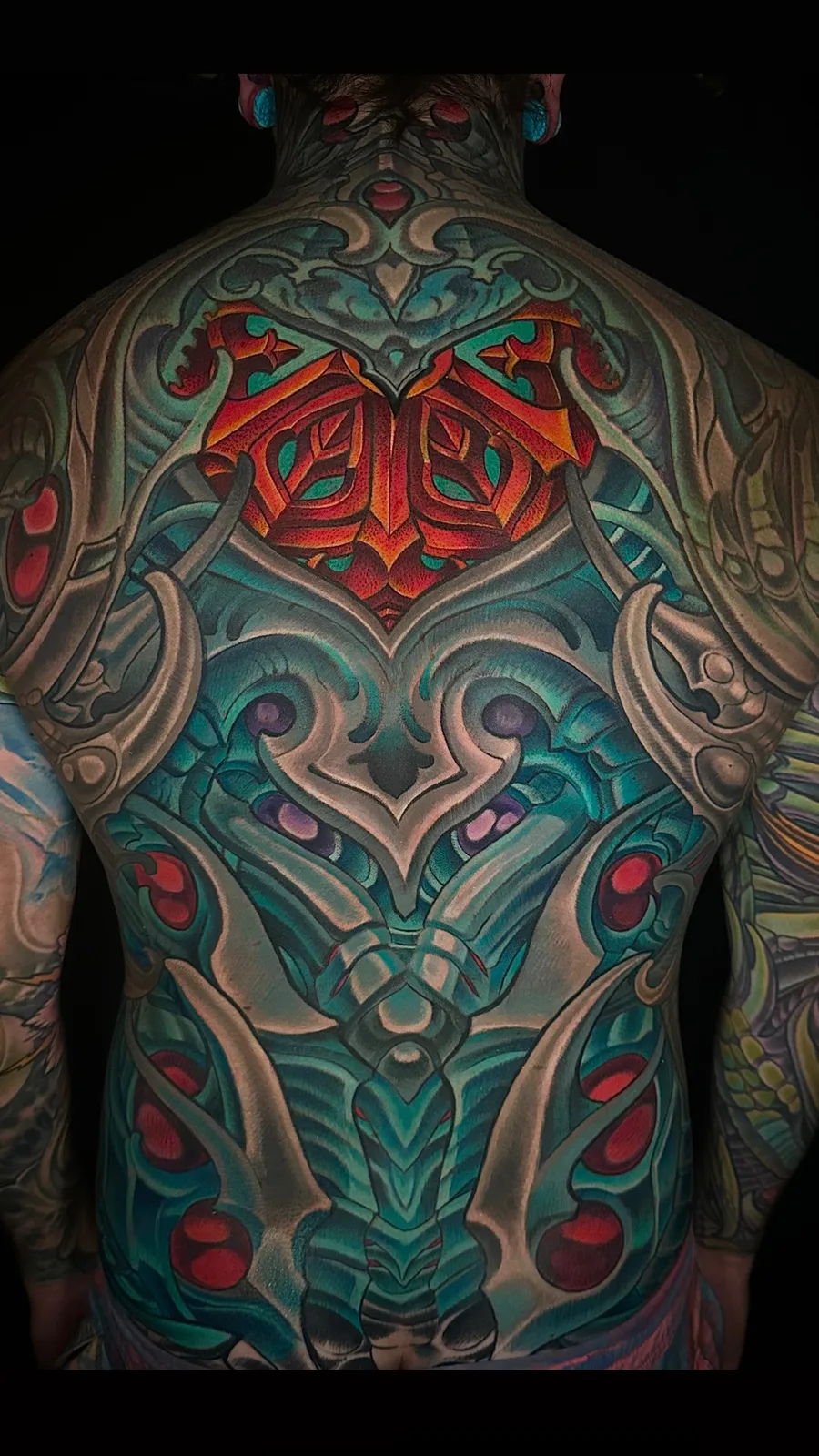 Full-color biomechanical and bio-organic full back piece tattoo by Terry Ribera, San Diego