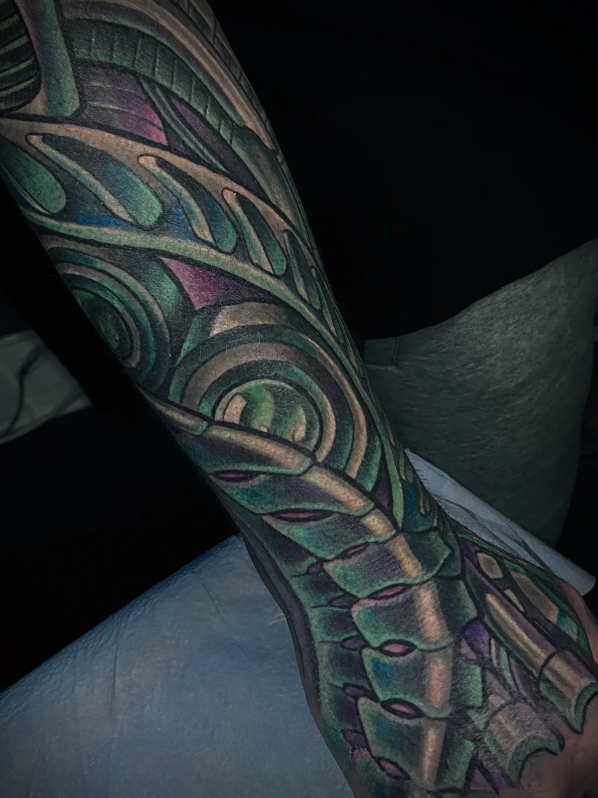 Grey biomechanical and bio-organic forearm tattoo by Terry Ribera, San Diego