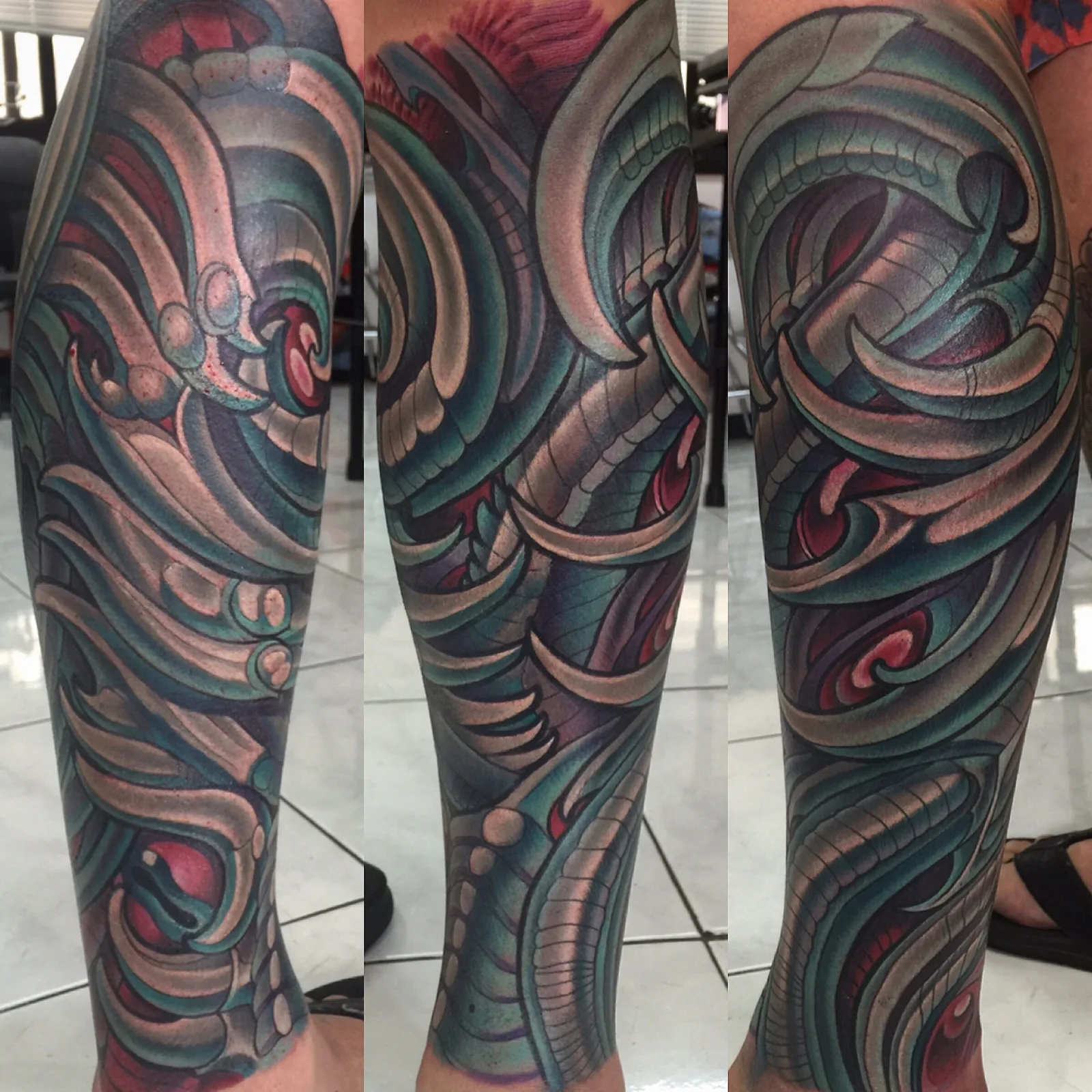 Purple and grey biomechanical and bio-organic leg sleeve tattoo by Terry Ribera, San Diego