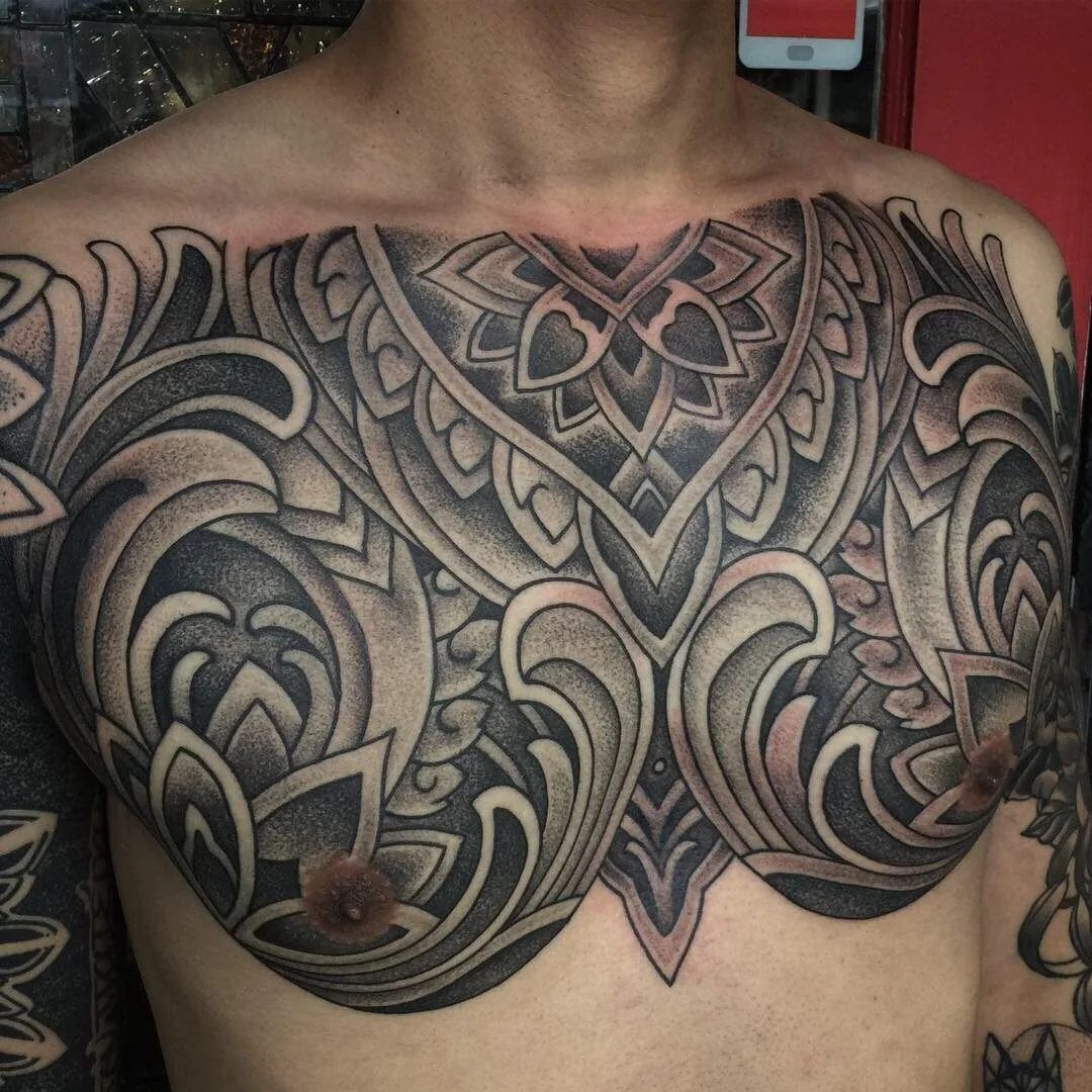 Ornamental mandala chest piece black grey tattoo by Terry Ribera, San Diego