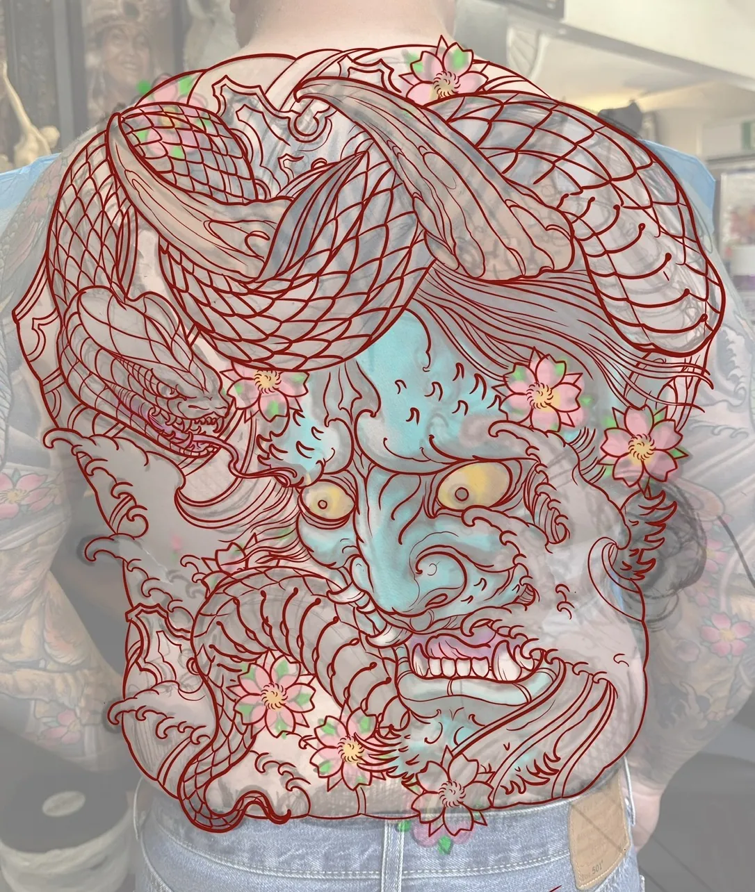 Custom tattoo sketch — Hannya dragon cherry blossom back piece design drawn on skin — original drawing by Terry Ribera, Remington Tattoo San Diego