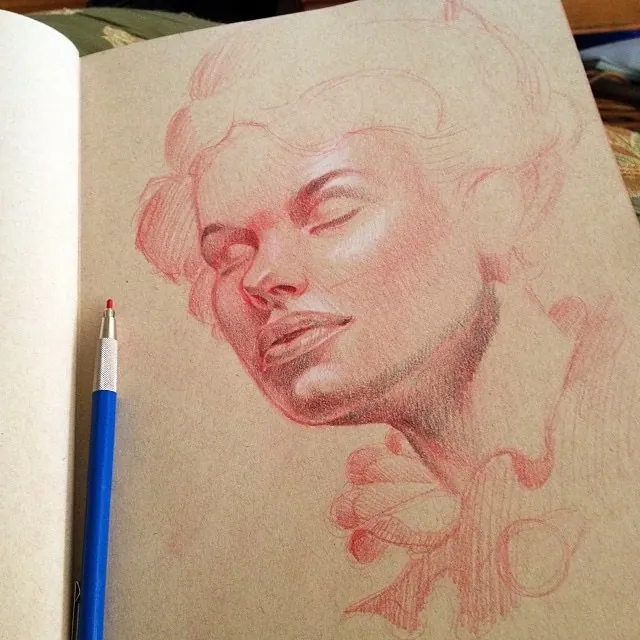 Custom tattoo sketch — Woman portrait red pencil sketchbook — original drawing by Terry Ribera, Remington Tattoo San Diego