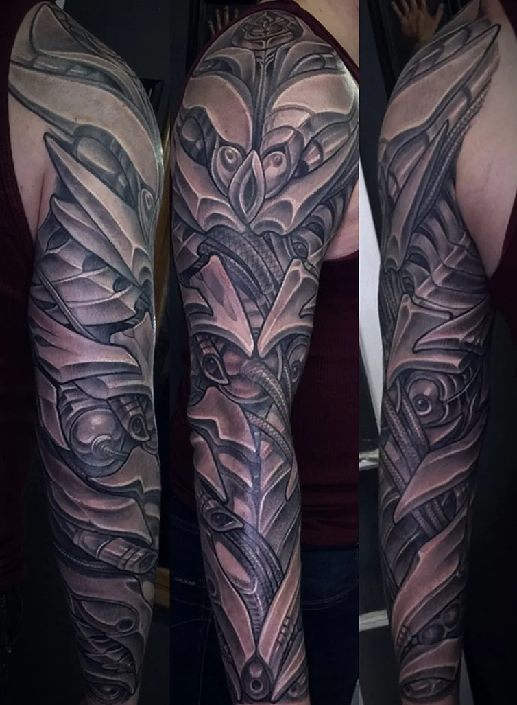 Biomechanical black and grey full sleeve tattoo by Terry Ribera at Remington Tattoo, North Park San Diego.