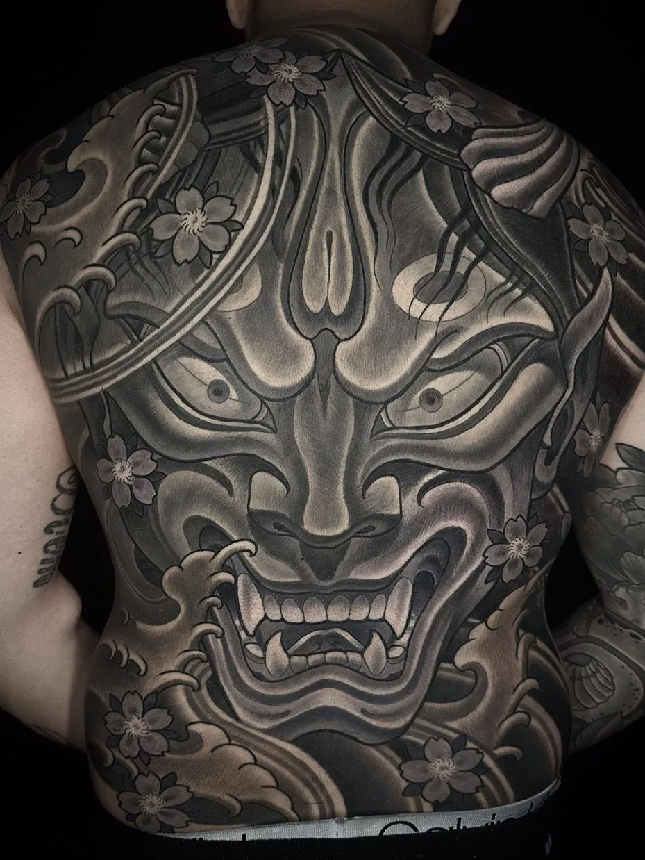 Neo-Japanese hannya mask full back black and grey tattoo by Terry Ribera at Remington Tattoo, San Diego.