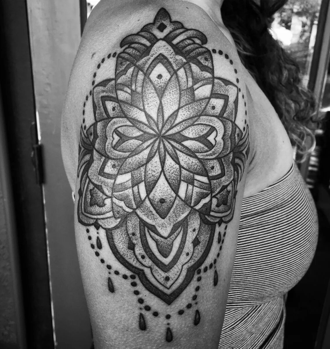 Ornamental mandala upper arm black and grey tattoo by Terry Ribera at Remington Tattoo, North Park San Diego.