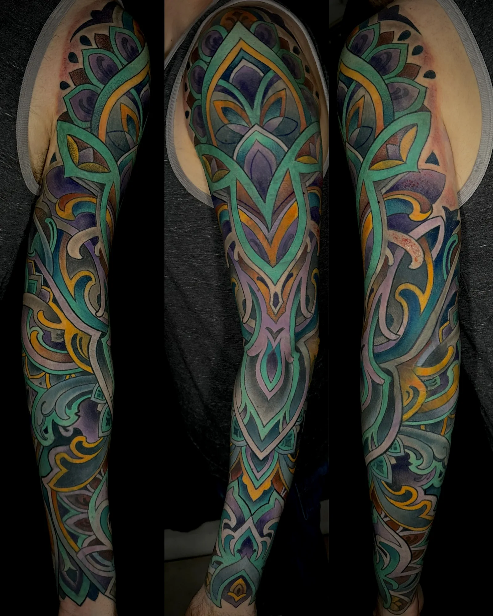 Teal and gold ornamental arm sleeve tattoo by Terry Ribera, San Diego